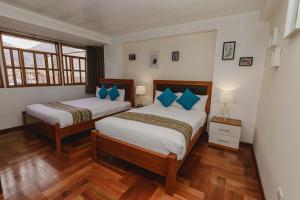 Postel nebo postele na pokoji v ubytování Cozy Room Cusco