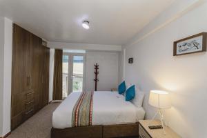 Postel nebo postele na pokoji v ubytování Cozy Room Cusco
