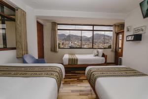 Postel nebo postele na pokoji v ubytování Cozy Room Cusco