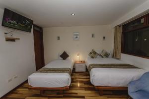 Postel nebo postele na pokoji v ubytování Cozy Room Cusco