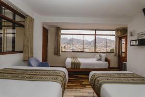 Postel nebo postele na pokoji v ubytování Cozy Room Cusco + 37 fotografií