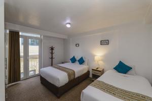 Postel nebo postele na pokoji v ubytování Cozy Room Cusco