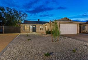 a house with a driveway and a garage at Splash In Your Private Free Heated Pool! in Glendale