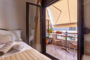 Postel nebo postele na pokoji v ubytování Mpalkoni Sti Monemvasia