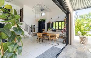 a kitchen and dining room with a table and chairs at Maison Piscine Proche Cassis in Gémenos