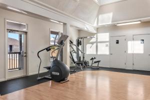 a gym with treadmills and ellipticals in a room at The Hook in Manteo