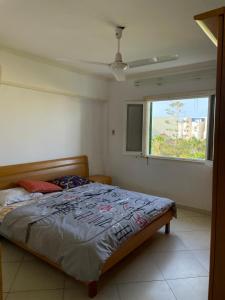 Ένα ή περισσότερα κρεβάτια σε δωμάτιο στο Aghadir Village قرية اغادير