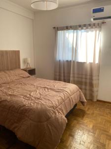 Postel nebo postele na pokoji v ubytování Departamento en el centro de la ciudad