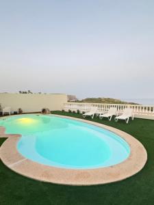 an image of a swimming pool in a resort at Sea View Suite with Pool - Praia da Luz in Luz