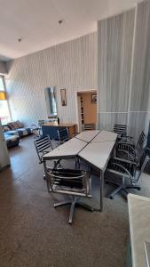 a large room with a large table and chairs at Apartment SKAISTUMS in Jūrmala