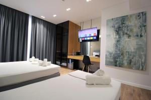 Postel nebo postele na pokoji v ubytování Valmar Hotel