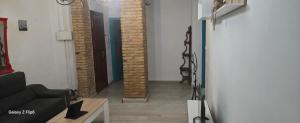 a hallway with brick columns in a living room at Relax y bienestar in Valencia