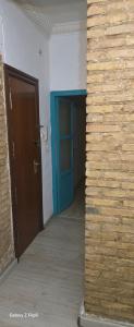 a hallway with a blue door in a building at Relax y bienestar in Valencia