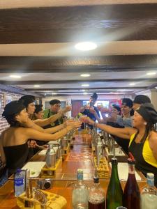 a group of people sitting at a bar at Life is Good Cartagena Hostel in Cartagena de Indias +45 photos