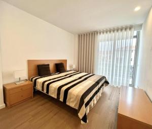 Giường trong phòng chung tại The Navigator Olympus