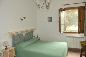 Postel nebo postele na pokoji v ubytování Agriturismo Renai e Monte II + 37 fotografií