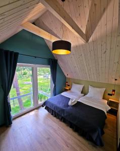 Postel nebo postele na pokoji v ubytování Domki Rozewie Art