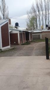an old brick building with a driveway in front of it at MARY ORM House 2 in Malargüe