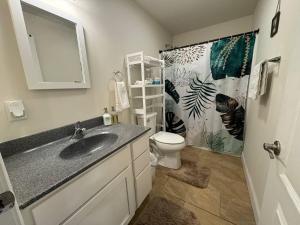 a bathroom with a sink and a toilet at Modern & Stylish 1-BR Condo near Downtown in Boston +18 photos