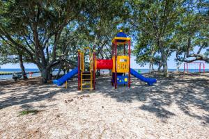 a playground with a slide on the beach at Sunbeam Sands in Kill Devil Hills