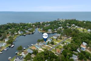 an aerial view of a town with a lake at Sunbeam Sands in Kill Devil Hills