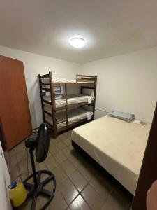 Ένα ή περισσότερα κρεβάτια σε δωμάτιο στο Republic Mansão