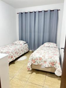 Ένα ή περισσότερα κρεβάτια σε δωμάτιο στο Apartamento prox Rodoviaria