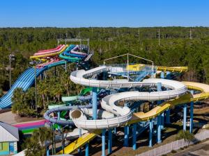 a group of water slides at a water park at Paradise Found Gulf Shores Beach Pools Dogs in Gulf Shores