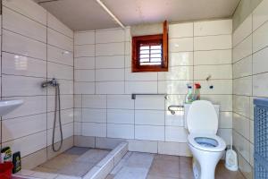 a bathroom with a toilet and a shower and a sink at Apartments by the sea Cove Kurila, Losinj - 24571 in Mali Lošinj