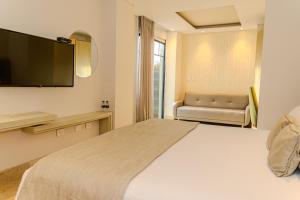 Voodi või voodid majutusasutuse Hotel Boutique Maree toas