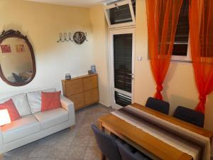 a living room with a couch and a table at Stella View in Krasici