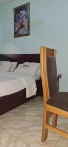 Rúm í herbergi á sudus hotel and lounge