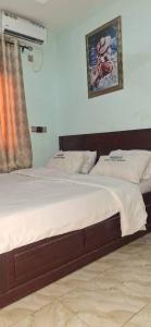 Rúm í herbergi á sudus hotel and lounge +12 myndir
