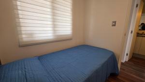 Ένα ή περισσότερα κρεβάτια σε δωμάτιο στο Oceana Suites Alto Panoramico Villarica
