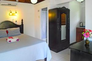 Postelja oz. postelje v sobi nastanitve Firefly Beach Cottages