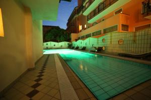 a swimming pool in the middle of a building at Hotel Santa Lucia in Bibione
