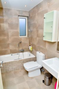 A bathroom at Legrena Beach Villa