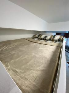 a large bed in a room with a mattress at MM Cozy Cabin in San Fernando