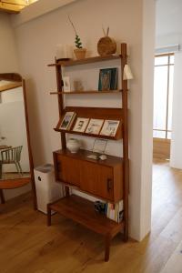 a wooden shelf in a room with a mirror at Stay Hosa in Suwon +80 photos