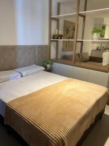 a bedroom with a bed with a large window at Departamento Funcional ll Punto Alquiler in Santiago del Estero