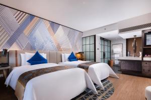 Letto o letti in una camera di Lingshui Xiangshui Bay Summer Surfing Resort