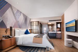 Letto o letti in una camera di Lingshui Xiangshui Bay Summer Surfing Resort