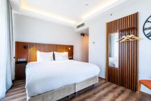Postel nebo postele na pokoji v ubytování Discovery Hotel
