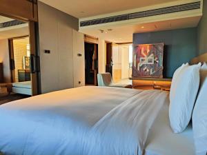 Letto o letti in una camera di Lingshui Xiangshui Bay Summer Surfing Resort