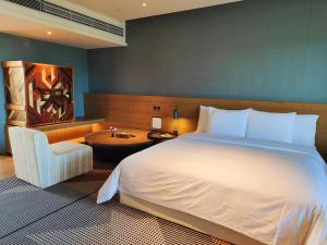 Letto o letti in una camera di Lingshui Xiangshui Bay Summer Surfing Resort