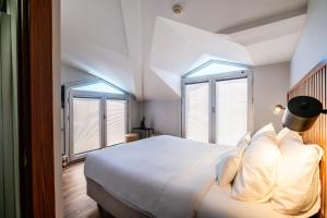 Postel nebo postele na pokoji v ubytování Discovery Hotel