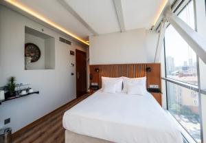 Postel nebo postele na pokoji v ubytování Discovery Hotel