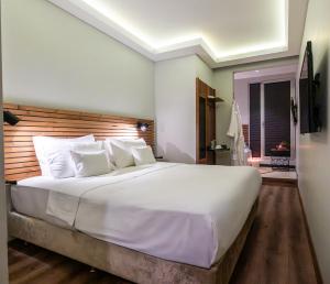 Postel nebo postele na pokoji v ubytování Discovery Hotel