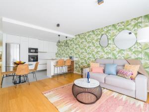 a living room with a couch and a table at Apartment in Las Palmas near Playa Alcaravaneras in Las Palmas de Gran Canaria