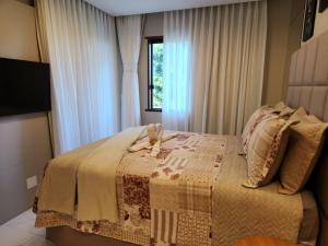 Ένα ή περισσότερα κρεβάτια σε δωμάτιο στο Casa em Praia do Forte Refúgio Luxo e Natureza